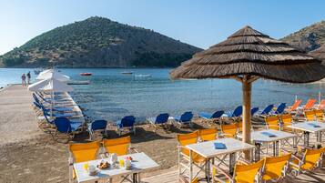 On the beach, sun-loungers, beach umbrellas