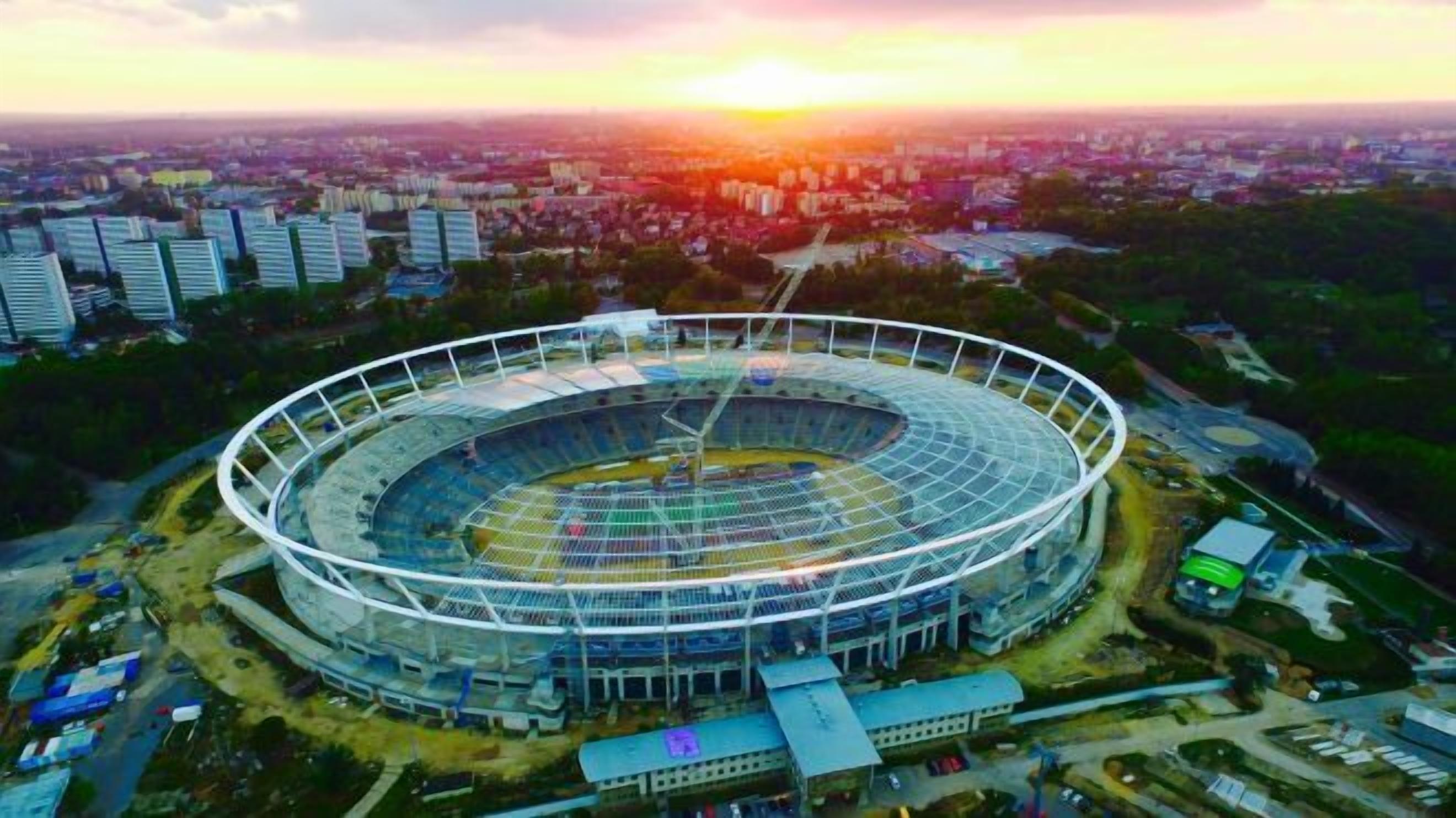 A large, circular stadium with a central field and multiple tiers of seating.
