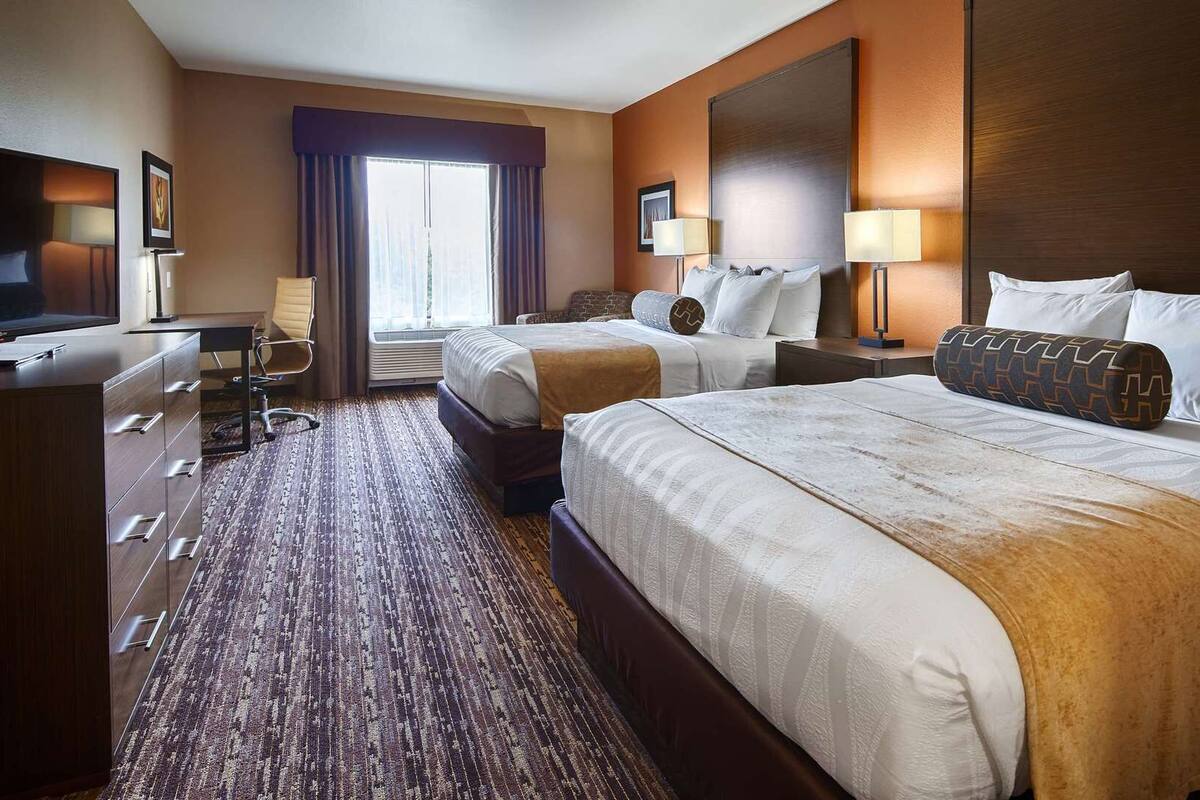 Premium bedding, pillow-top beds, desk, laptop workspace