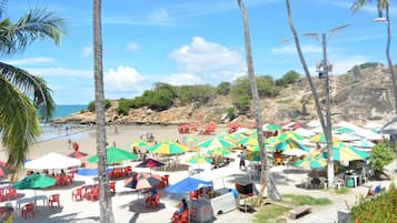 On the beach, sun-loungers, beach umbrellas