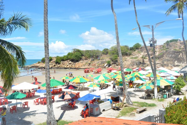 On the beach, sun-loungers, beach umbrellas