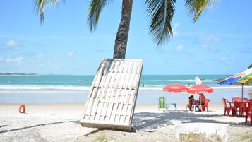 On the beach, sun-loungers, beach umbrellas