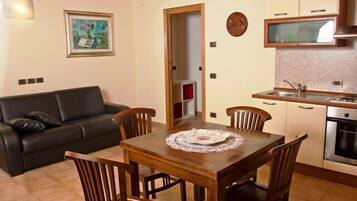 Family Apartment | Living area | 22-inch LCD TV with satellite channels, TV