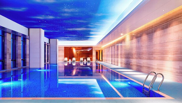 A modern indoor swimming pool with a starry sky ceiling and a long, narrow pool area. - Sheraton Harbin Xiangfang Hotel (Harbin)