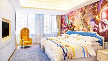 A hotel room with a large bed, a TV mounted on the wall, a chair, and a window with curtains.