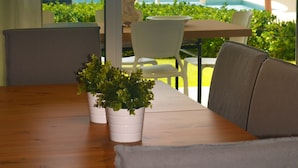 Flat-screen TV - Infiniti Blu Luxury Ocean Front Condos  (Sosúa)