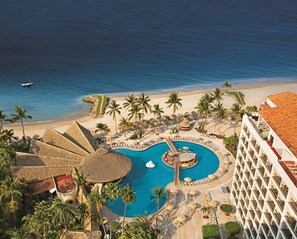 A resort with a large pool, palm trees, and a beach. - Sunscape Puerto Vallarta Resort & Spa All Inclusive (Puerto Vallarta)