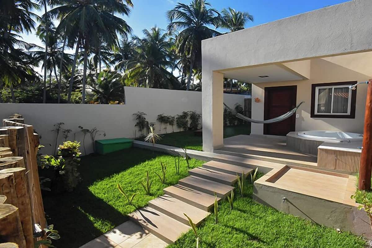 Habitación Confort, hidromasaje, en el área del jardín | Área de sala de estar