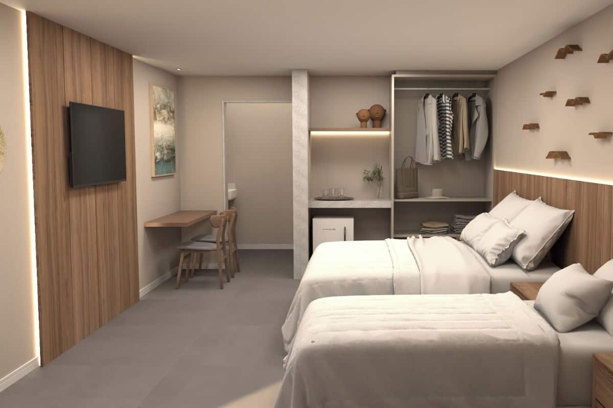 Ropa de cama de alta calidad, minibar y tabla de planchar con plancha