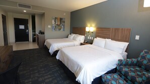 A hotel room with two beds, a sofa, a desk, and a bathroom visible through an open door. - Holiday Inn Express & Suites Mexicali by IHG (Mexicali)