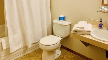 Standard Room, 1 King Bed | Bathroom | Combined shower/tub, hair dryer