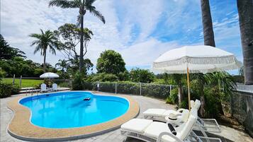 Seasonal outdoor pool, open 8:00 AM to 8:00 PM, pool umbrellas