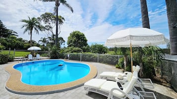 Seasonal outdoor pool, open 8:00 AM to 8:00 PM, pool umbrellas