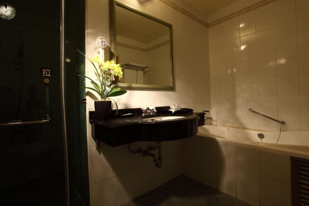 rainfall showerhead, hair dryer, slippers, towels