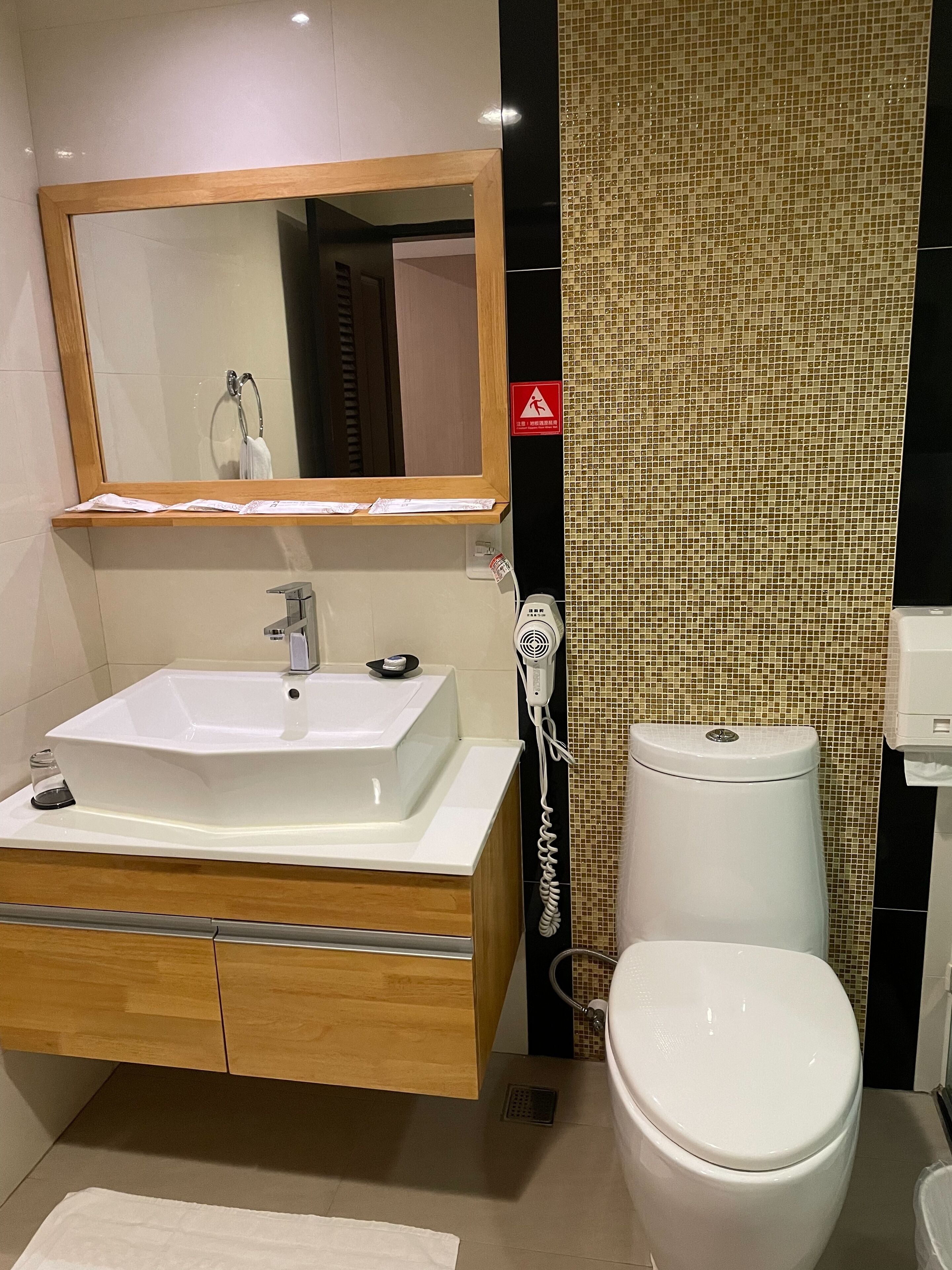 rainfall showerhead, hair dryer, slippers, towels