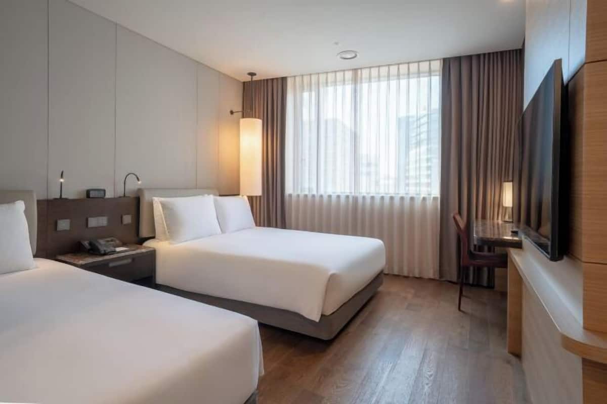Premium bedding, down comforters, pillowtop beds, in-room safe