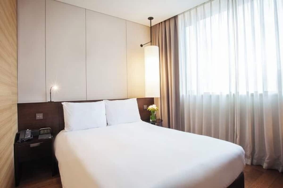 Premium bedding, down comforters, pillowtop beds, in-room safe