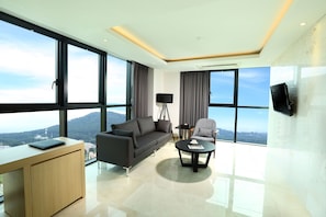 Suite (The One) | Living area | 40-inch LED TV with cable channels, TV