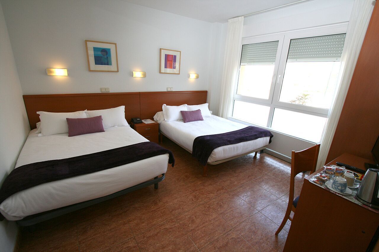 Desk, blackout curtains, free cots/infant beds, free WiFi