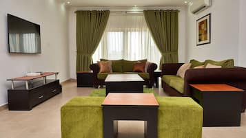 One Bedroom Apartment | Living room | Flat-screen TV, DVD player