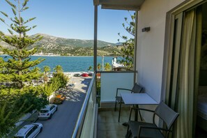 Triple Room with Sea View | Pillow-top beds, minibar, in-room safe, desk