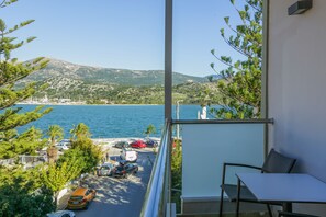Triple Room with Sea View | Pillow-top beds, minibar, in-room safe, desk