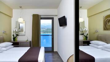 Colchones con pillow-top, minibar y caja de seguridad en la habitación