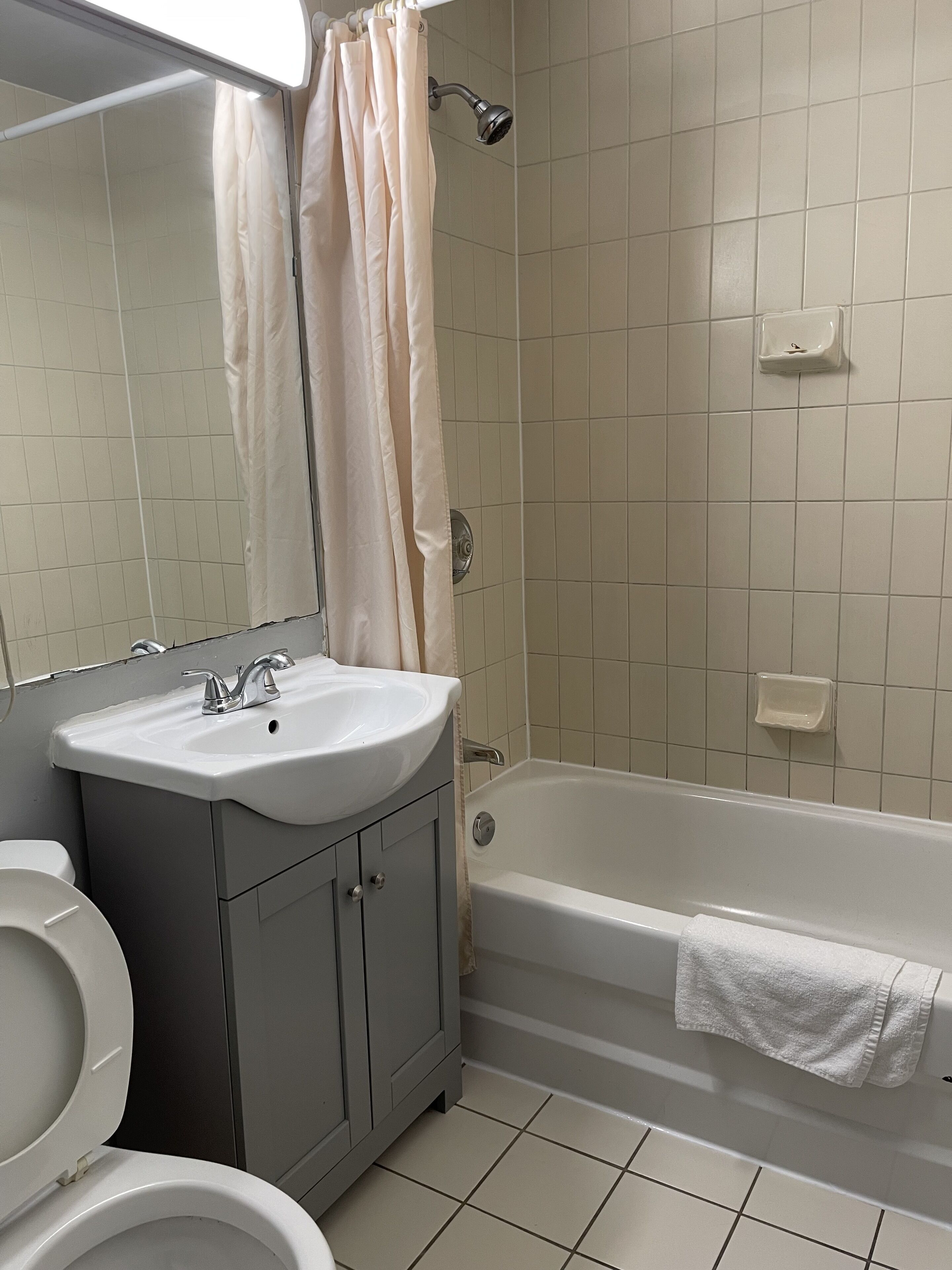Standard Room, 2 Queen Beds | Bathroom | Combined shower/tub, free toiletries, hair dryer, towels