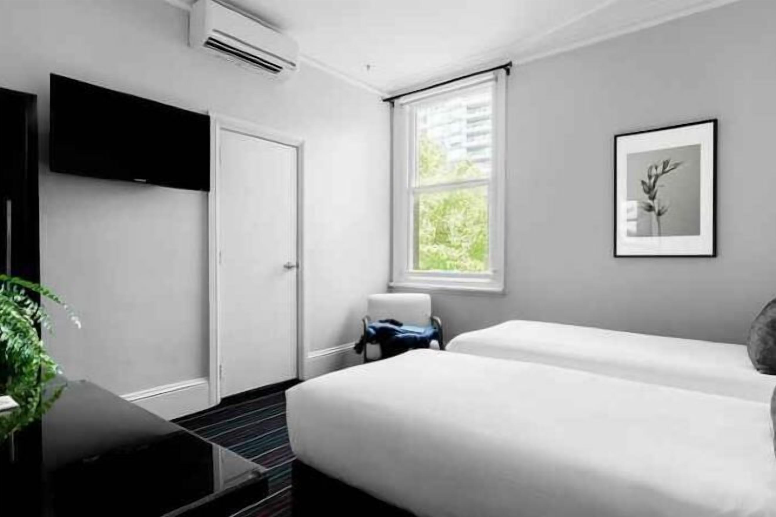 Premium bedding, desk, laptop workspace, blackout drapes