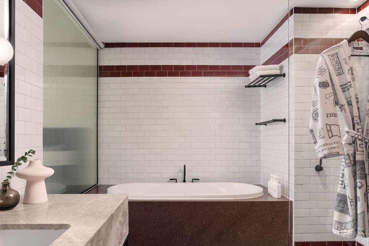 Shower, designer toiletries, hair dryer, bathrobes