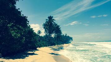 On the beach, white sand, beach shuttle, beach towels