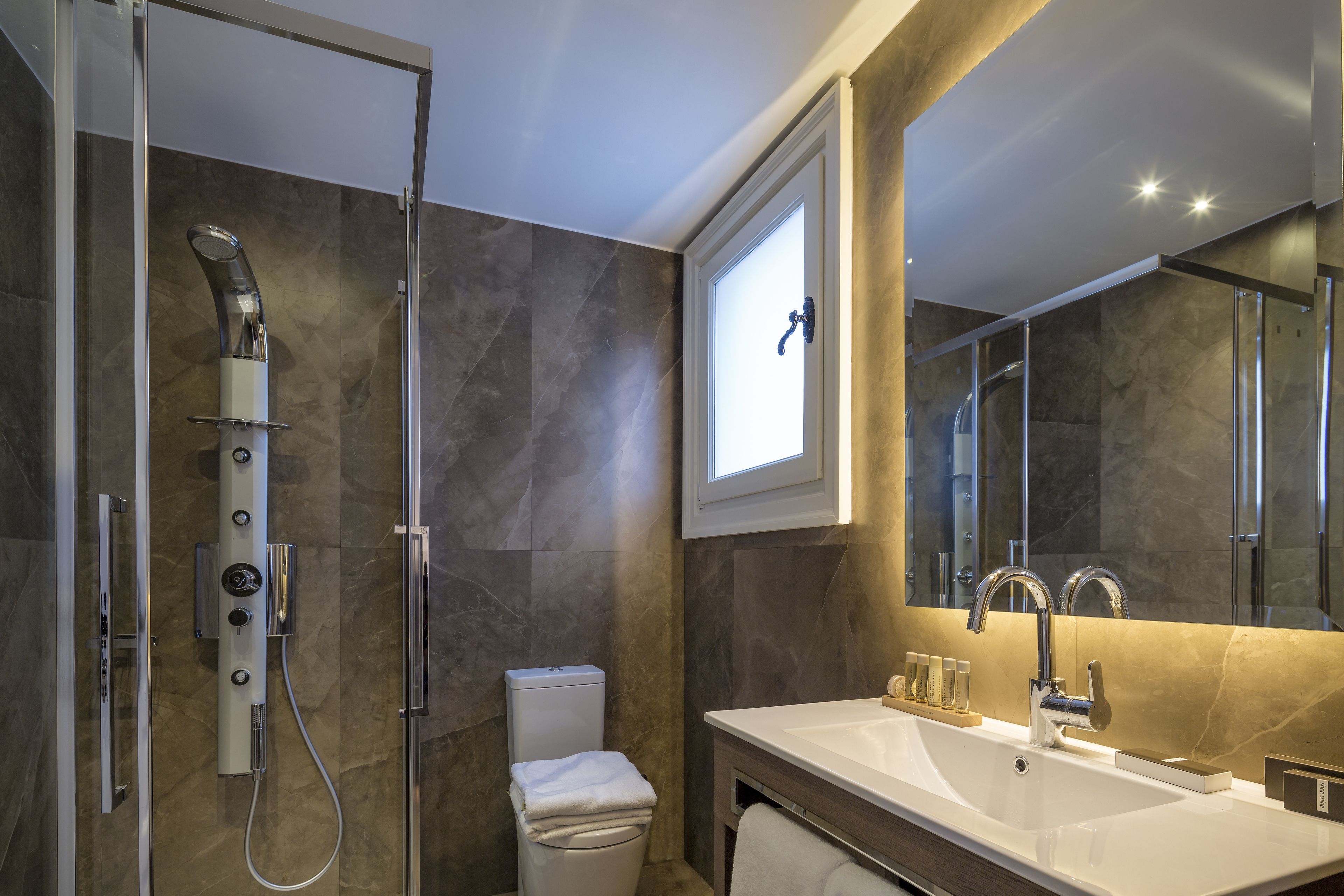 jetted bath, hydromassage showerhead, designer toiletries, hair dryer