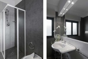 Deluxe Room | Bathroom | Hair dryer, bidet, towels