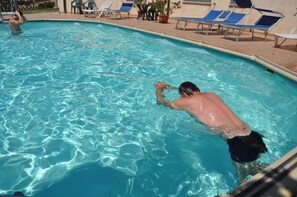 Seasonal outdoor pool, pool loungers