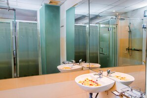Suite, City View | Bathroom | Shower, free toiletries, hair dryer, slippers
