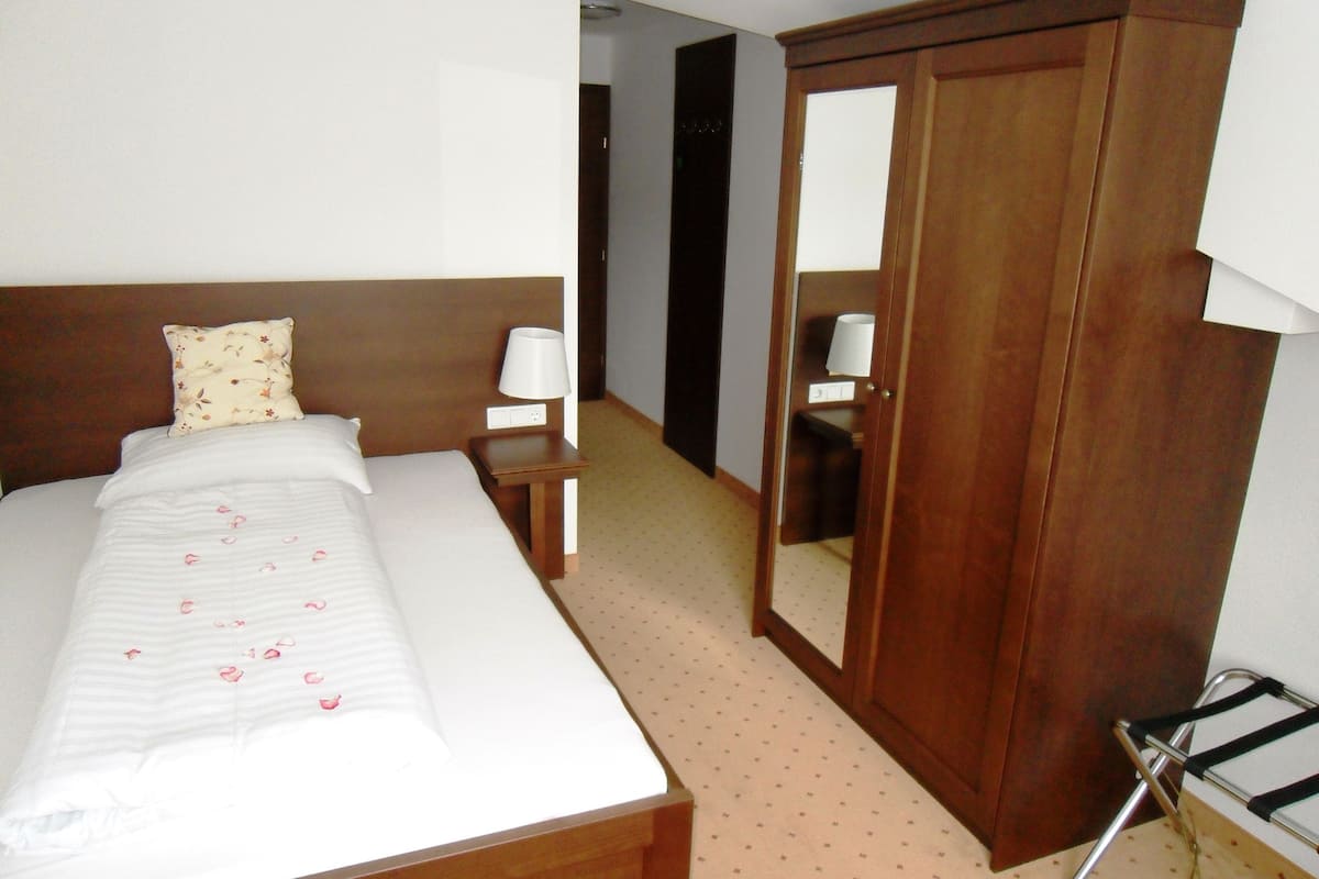 Premium bedding, desk, laptop workspace, blackout curtains