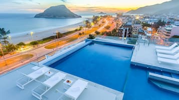 Outdoor pool, open 8:00 AM to 8:00 PM, pool umbrellas, pool loungers