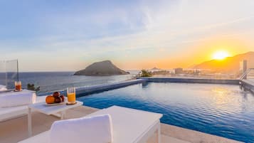 Outdoor pool, open 8:00 AM to 8:00 PM, pool umbrellas, sun loungers
