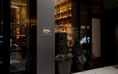 A storefront with a sign reading "Arlo NoMad."