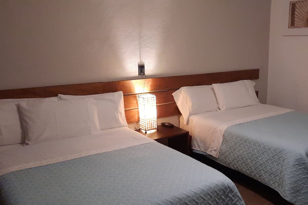 standard quadruple room, 2 double beds | free cots/infant beds, free wifi, bed sheets