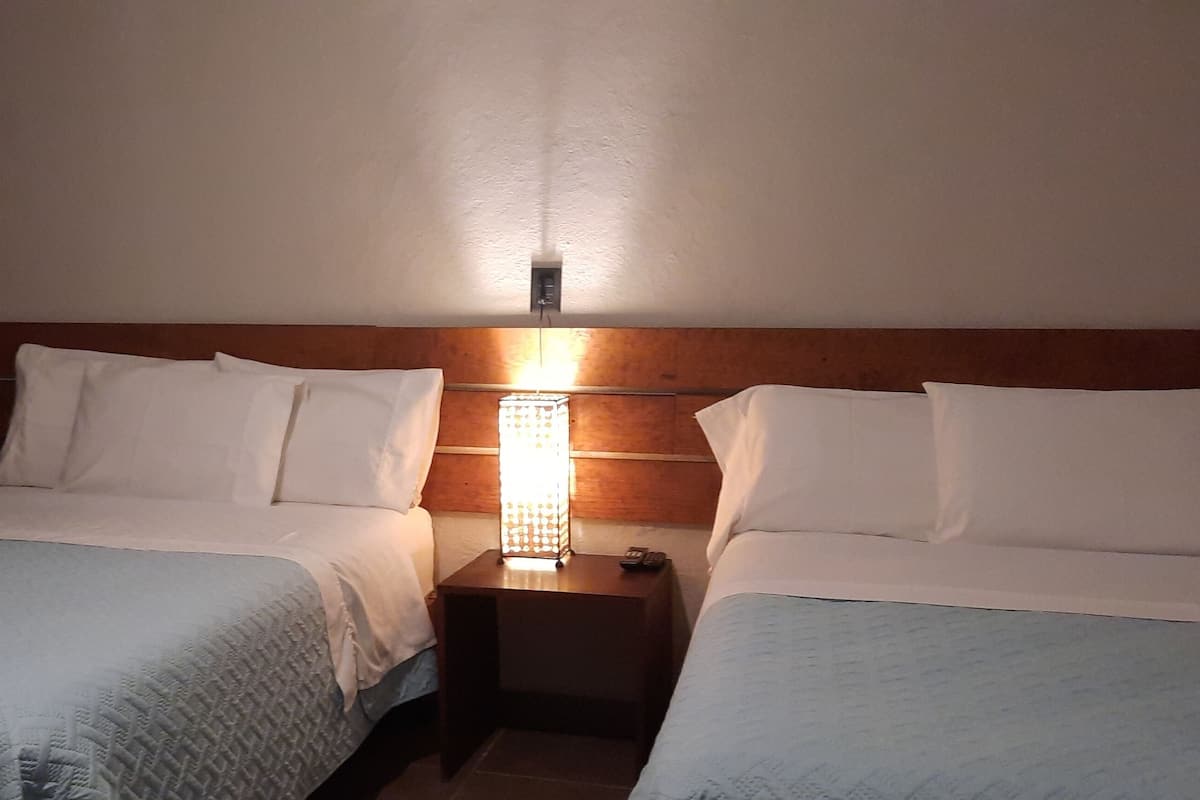 standard quadruple room, 2 double beds | free cots/infant beds, free wifi, bed sheets