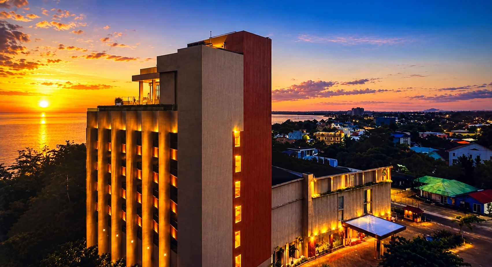 A high-rise hotel with a modern design, featuring a prominent vertical structure and a flat roof.