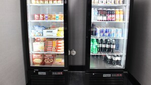Two refrigerated display cases with various food and drink items.