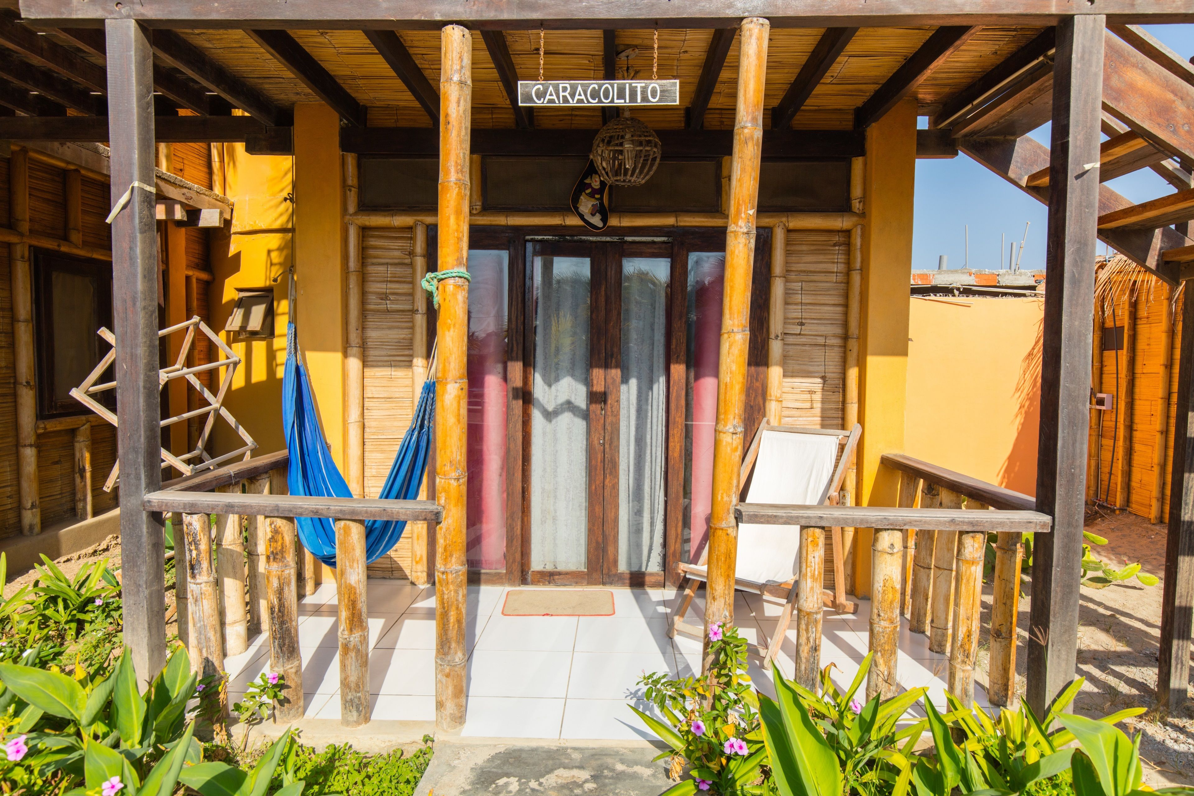 A wooden structure with a sign reading "CARACOLITO".