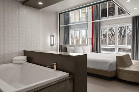 Superior Suite, 1 King Bed, Non Smoking | Jetted bathtub. Ramada by Wyndham Laval