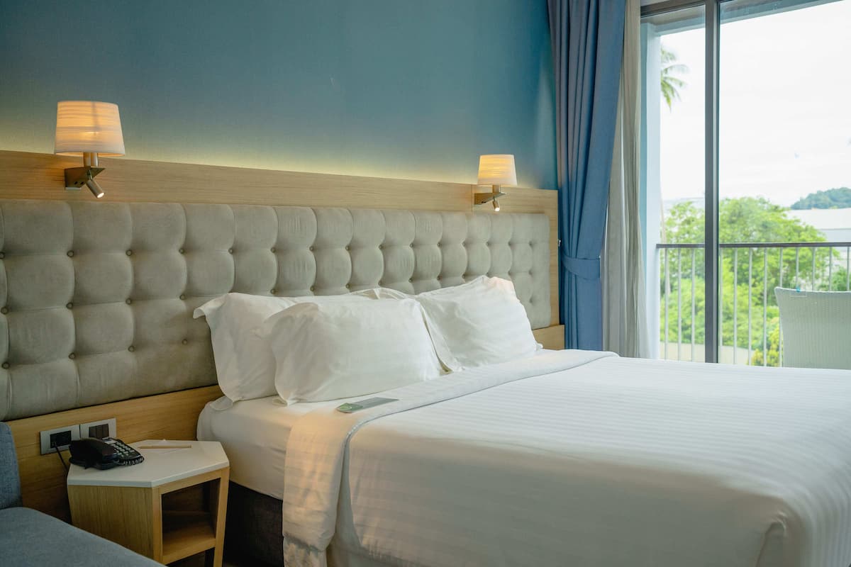 Deluxe Room with Balcony | In-room safe, desk, blackout curtains, soundproofing