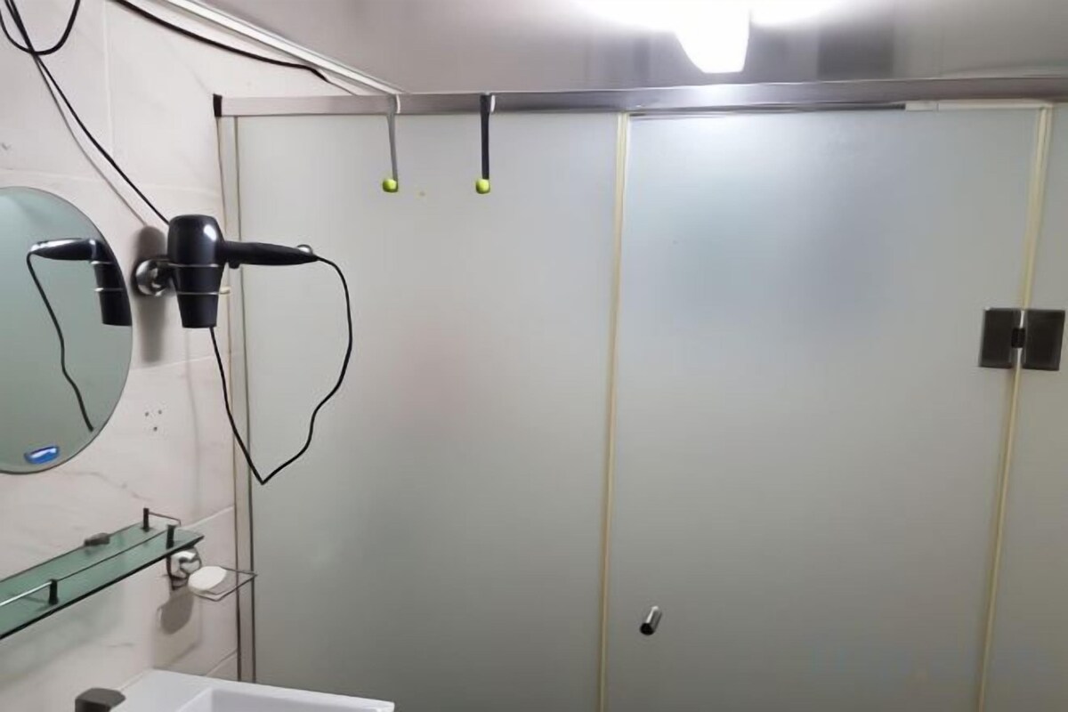 Bathroom | Shower, hair dryer, slippers, towels