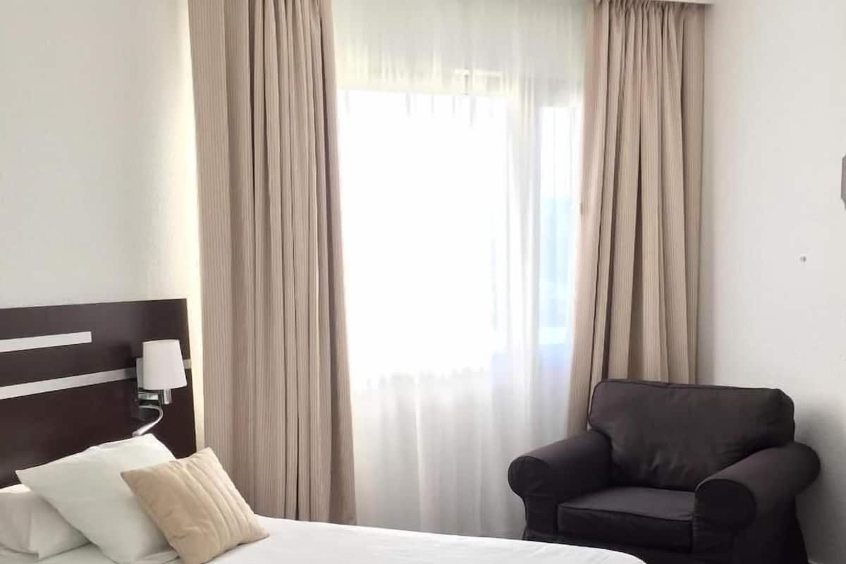 Comfort Twin Room | Premium bedding, desk, blackout drapes, soundproofing