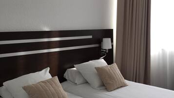Premium bedding, desk, blackout drapes, soundproofing