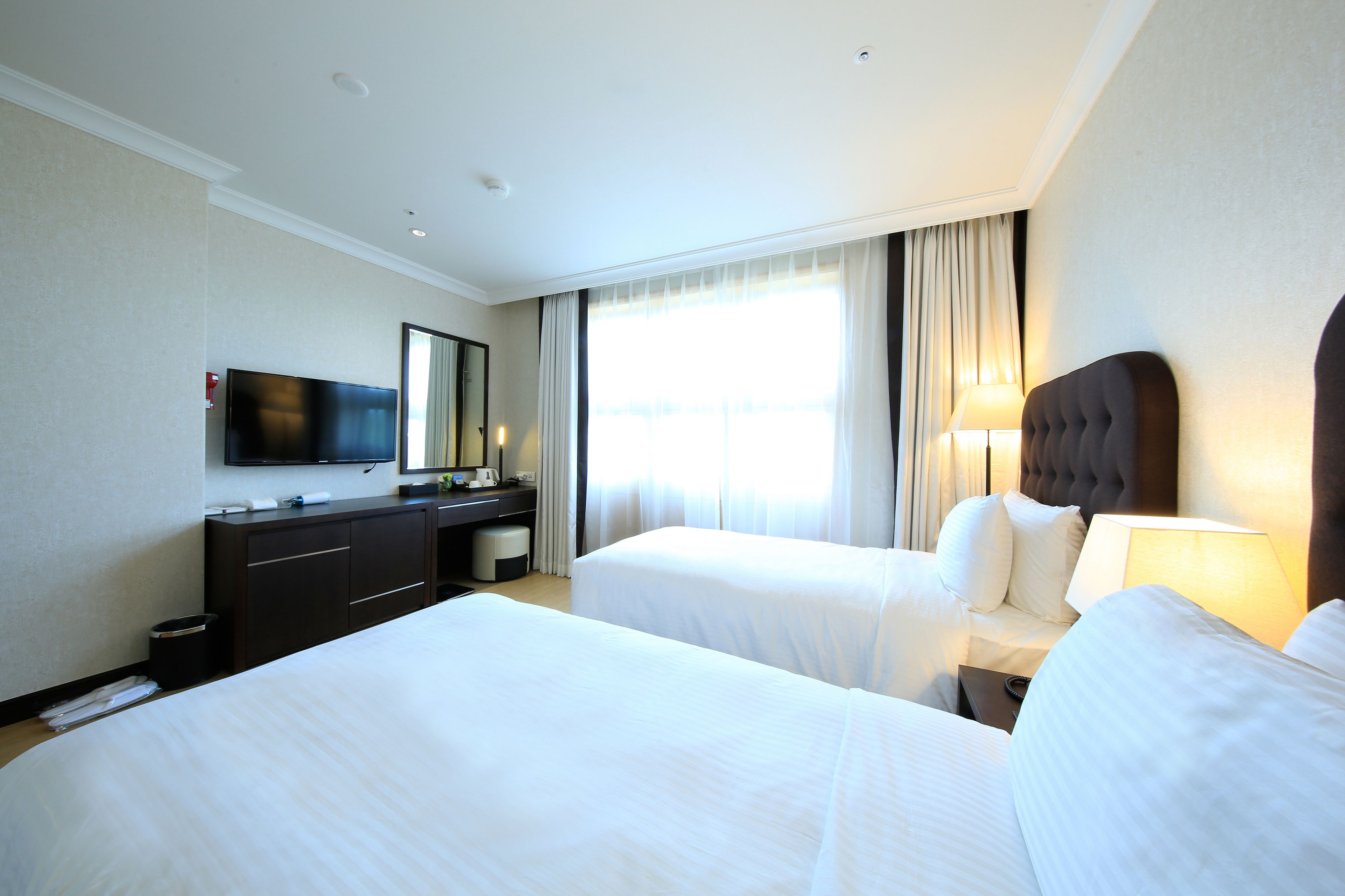 standard twin room (hotel) | down duvets, in-room safe, desk, blackout curtains